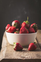 Appetizing Organic Strawberry in the Bowl Dark Photo Vertical Wooden Background