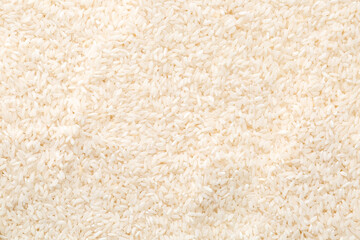 Raw rice as background, closeup