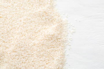 Raw rice on light background, closeup