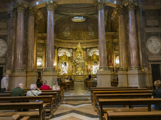Fototapeta na wymiar Zaragoza, Spain, church interior and people in service