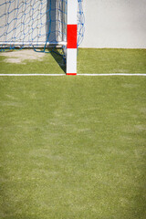 Goal with red and white goalpost for football or handball. Sport, recreation and healthy lifestyles on fresh air