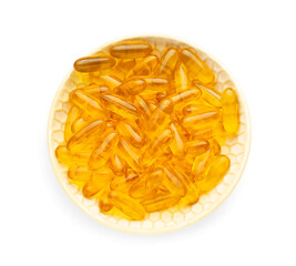 Plate with fish oil capsules on white background
