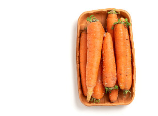 Fresh organic carrots on a white background top view. Natural vegetables concept.