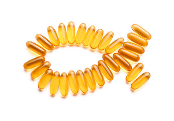 Fish made of oil capsules on white background