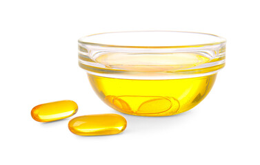 Bowl of fish oil and capsules on white background