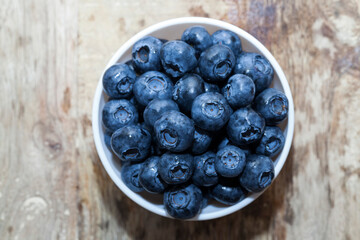 fresh ripe blueberries in a glass bowl
