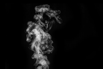 Perfect mystical curly white steam or smoke isolated on black background. Abstract background fog or smog