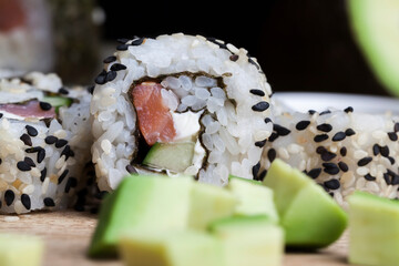 made from rice and trout or salmon with avocado sushi food