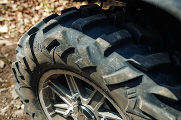 All-terrain tire on wheel of ATV car