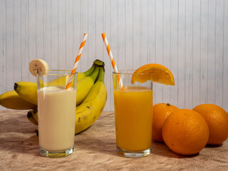 Fresh apple juice with straws in a glass.
