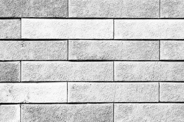 Texture of a brick wall with cracks and scratches which can be used as a background