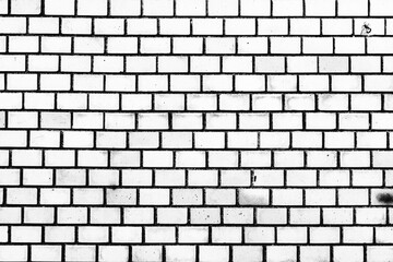 Texture of a brick wall with cracks and scratches which can be used as a background