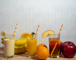 Orange, banana and apple cocktail.