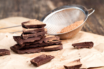 divided into pieces a piece of chocolate from cocoa