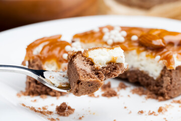 tartlet with milk cheese filling and lots of salted caramel with nuts