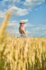 Young girl with long hair in a field