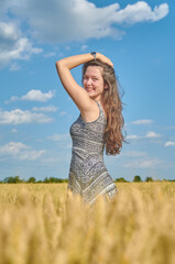 Young girl with long hair in a field