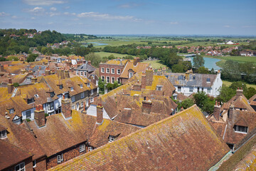 Rye, East Sussex, England, UK - June 13, 2021: Aerial view across rooftops of picturesque Cinque Port town, a popular travel destination in East Sussex.