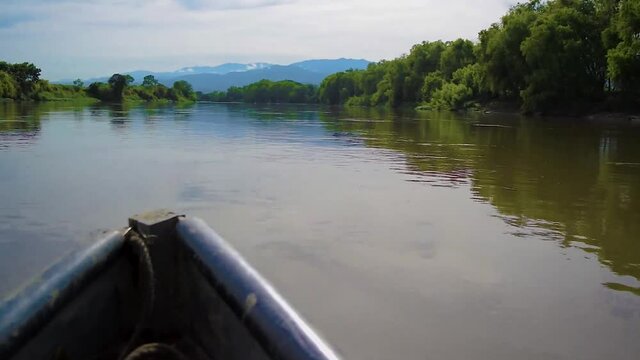 Boat sailing on a muddy river in Colombia