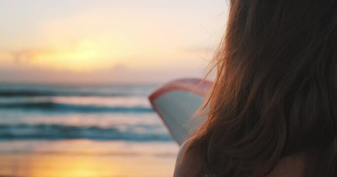 Girl surfer. Portrait of the young adult woman with surfboard at sunrise