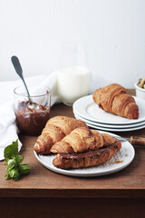 Freshly baked croissants with chocolate cream.