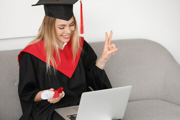 Happy female student on her graduation day at home. Concept of online education