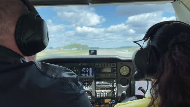 4k Pilots in a cockpit ready for flight. The plane preparing for takeoff.