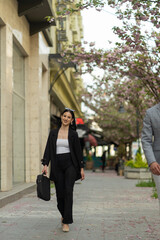 Businesswoman is smiling while walking