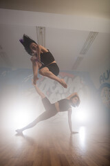 Group of multiracial dancers are exercising and practicing in their studio in slow motion