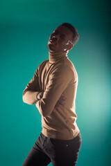 Black male posing in studio isolated on blue