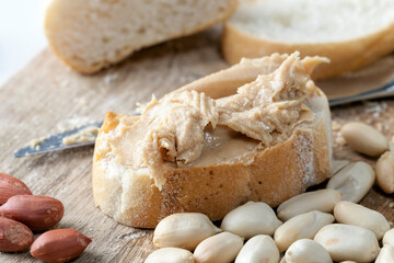 preparing a quick Breakfast of bread and peanuts