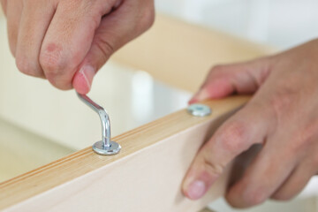 Assembly wooden furniture at home using screw allen