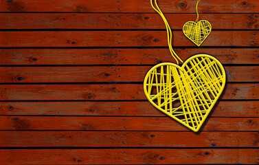 Two Hearts On Rustic Wooden table brown Background.  2 Heart Shape yellow with ropes in vintage wood,  Love Concept 