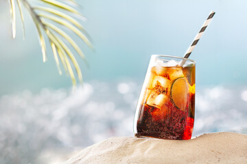 Refreshing cocktail with ice on the beach