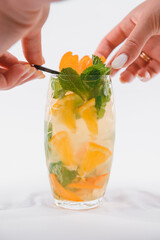 Glasse Of Drink With Ice Cubes And Fruits On White Background