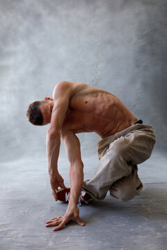 Young beautiful cool looking bboy posing in studio