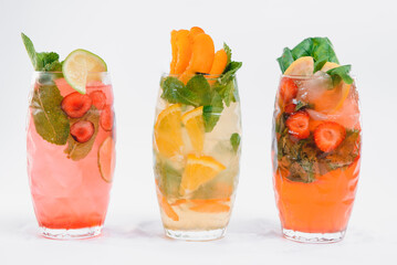 set with different fruits cocktails on white background