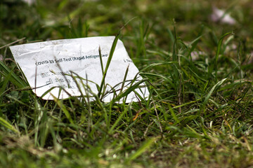 Covid19 Test Kit Wrapper On The Grass