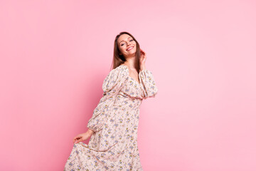 Photo portrait smiling girl wearing printed dress dancing in summer isolated pastel pink color background
