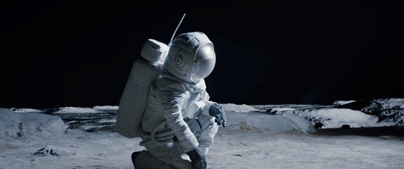CU Portrait of Caucasian female lunar astronaut finds something and kneels while exploring Moon surface. Shot with 2x anamorphic lens © supamotion
