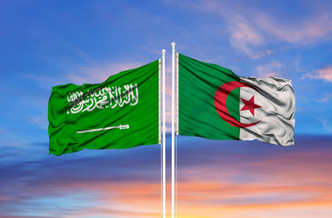 Algeria and Saudi Arabia two flags on flagpoles and blue sky