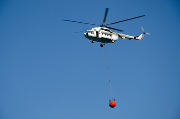 firefighter
 helicopter in the blue sky