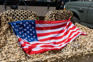 American flag stretched on a camouflage net