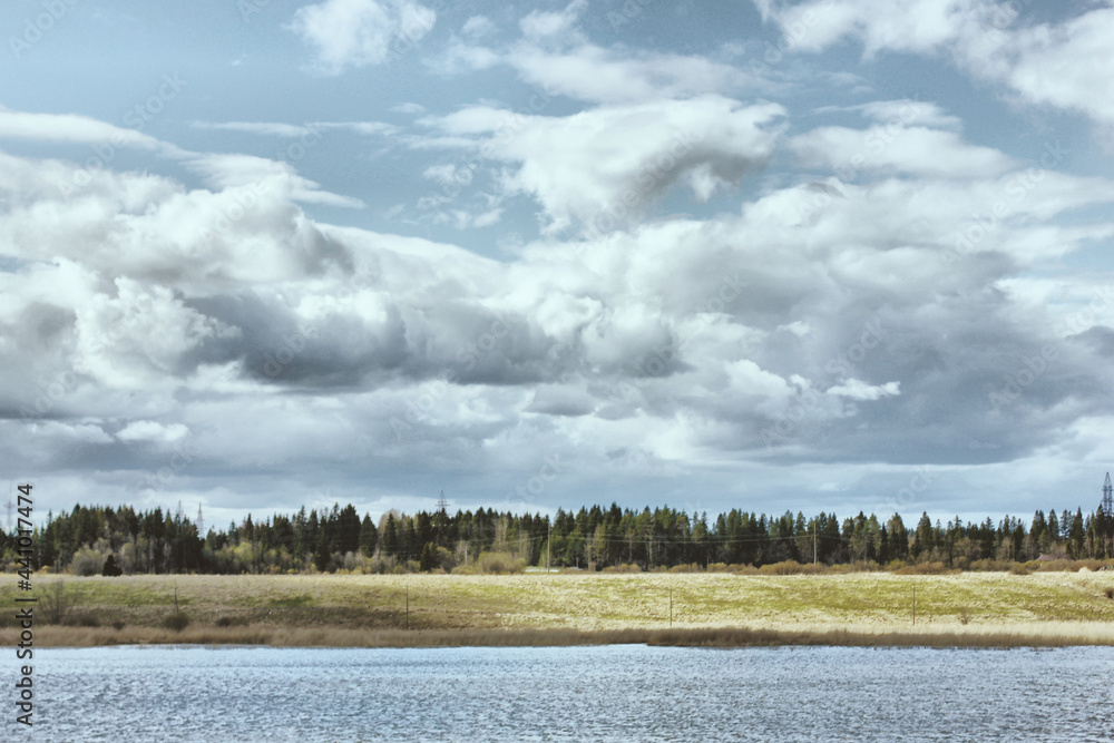 Wall mural clouds over the lake