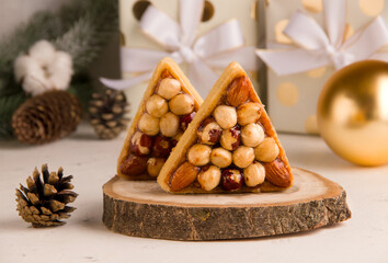 Christmas sweets on a light background with gifts. Cookies with nuts