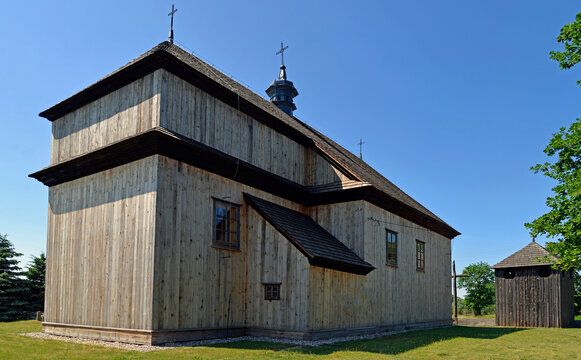 The belfry built in 1792 with the church of St. John the Baptist in the village of Gąsiorowo in Masovia, Poland. The photos show a general view and architectural details of the temple and belfry.
