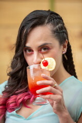 Mexican young woman summer portrait eating drinking cocktail