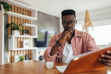 Adult man, making sure his bank account is clean.