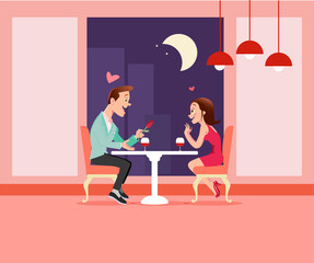 Romantic Dinner. Boy and girl having a romantic dinner in a fancy restaurant toasting with wine