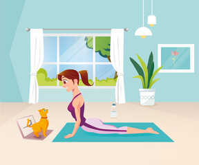 Girl doing yoga at home with cat on computer